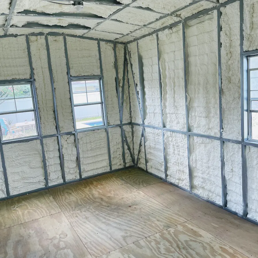 Closed-cell spray foam insulation applied to wall cavities in a residential project in Stevens Point